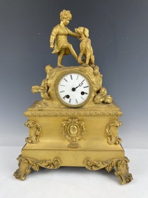 EMPIRE STYLE DORE BRONZE CLOCK: Circa 1850. Measures 17 inches tall. Estimate $1.000-1.200