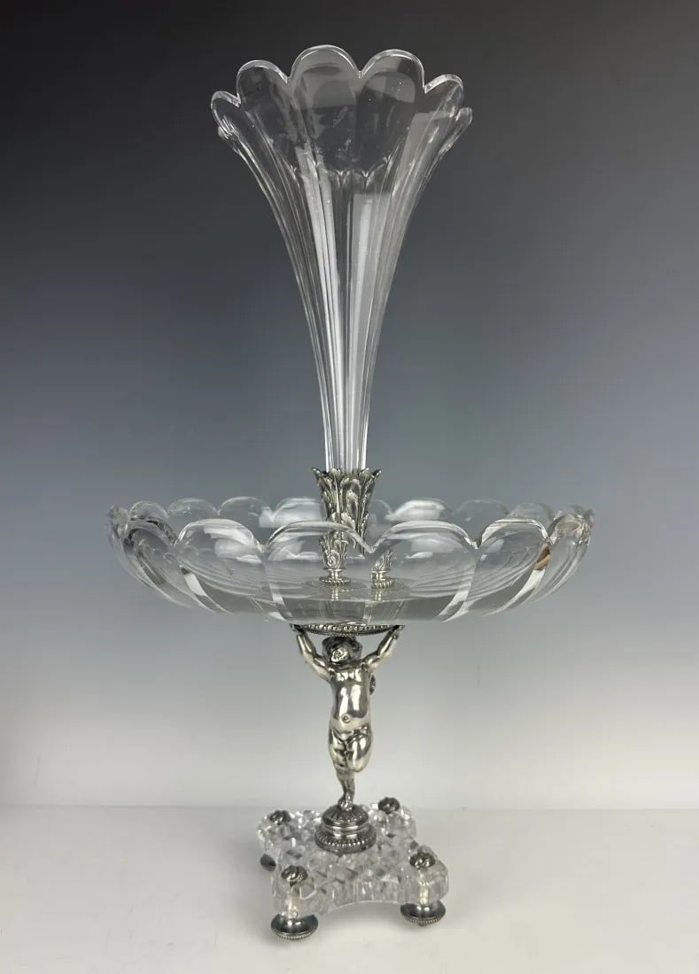 SILVERED BRONZE AND BACCARAT CRYSTAL CENTREPIECE: Circa 1900. Measures 12.5 inches high. Stamped Baccarat. In good antique condition.Estimate $3.000-4.000