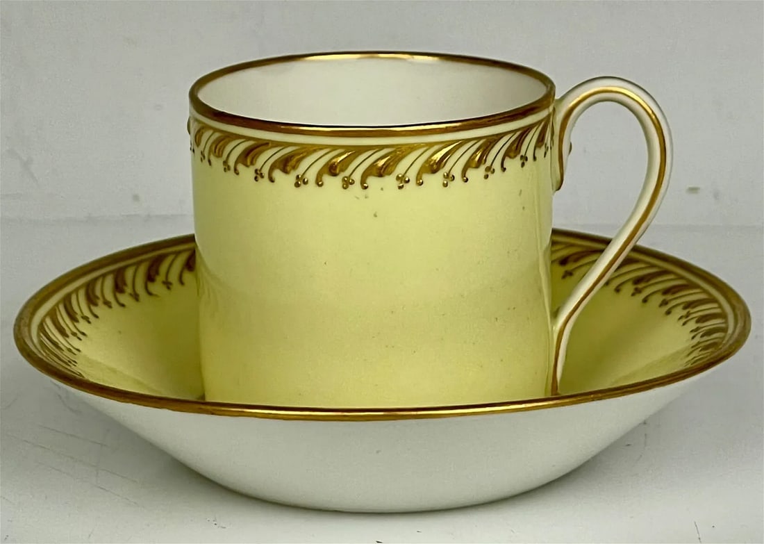 BERLIN KPM YELLOW GROUND DEMITASSE CUP AND SAUCER: Circa 1900. In good condition. Estimate $500-600