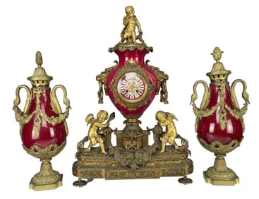 A LARGE DORE BRONZE AND SEVRES PORCELAIN CLOCK GARNITURE