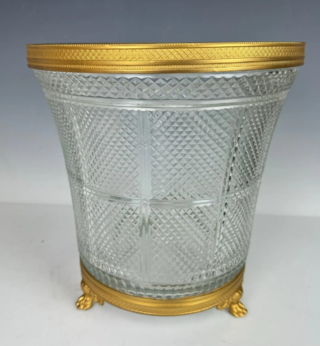 EMPIRE STYLE ORMOLU MOUNTED BACCARAT CRYSTAL ICE BUCKET: Circa 1900. Measures 10 inches high. In excellent condition. Estimate $1500-2000