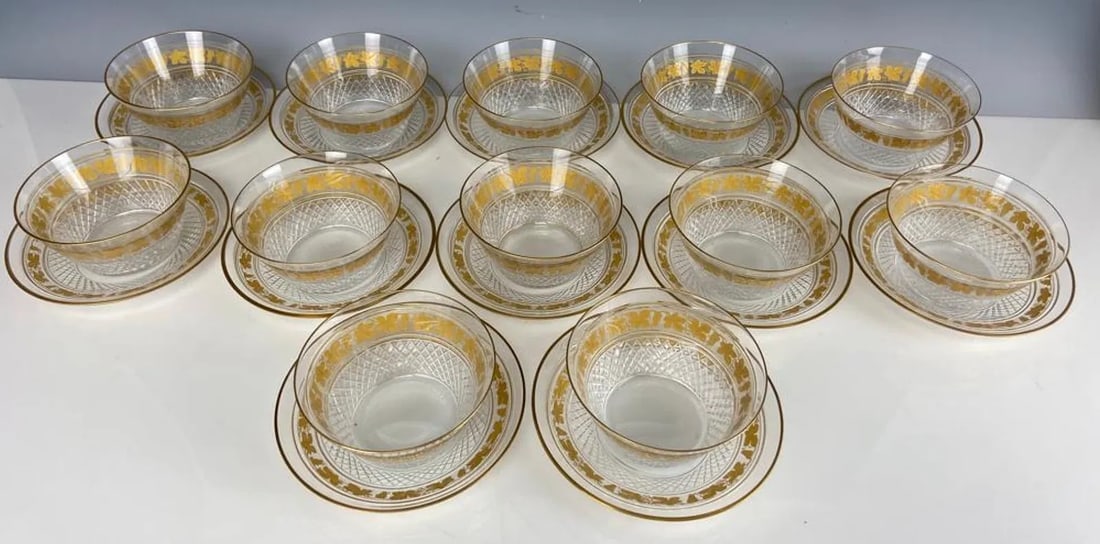 SET OF 12 GILT CRYSTAL FINGER BOWLS AND PLATES: Measure 5.7 inches d. All in excellent condition. Estimate $1200-1500