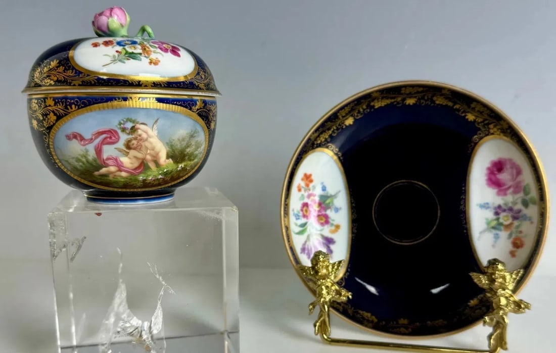 19TH C. BERLIN KPM COVERED DEMITASSE CUP AND SAUCER: Circa 1880. In good used condition, no chips, no repairs. Estimate $1200-1500