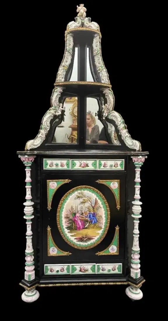 A MONUMENTAL BERLIN KPM CORNER CABINET: Circa 1850. Measures 92 inches high. Large plaques marked with sceptre sign and inscribed KPM. Estimate $20.000-25.000