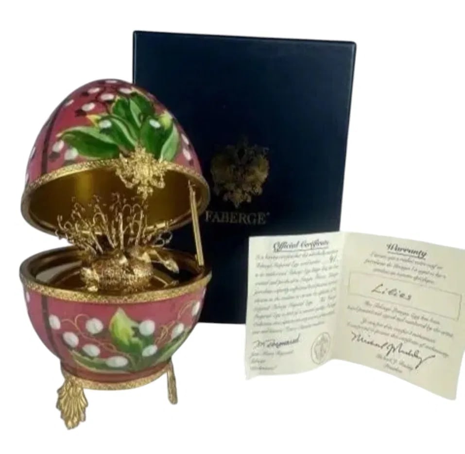 IMPERIAL FABERGE LIMOGE PORCELAIN AND STERLING SILVER EGG: Lilies of The Valley. Stamped 925. I with original presentation box. With coa. Estimate $1.500-2.000
