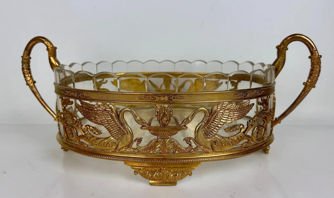 A LARGE EMPIRE STYLE ORMOLU AND BACCARAT CRYSTAL CENTERPIECE: Circa 1900. Measures 17 inches long. Estimate $1500-2000