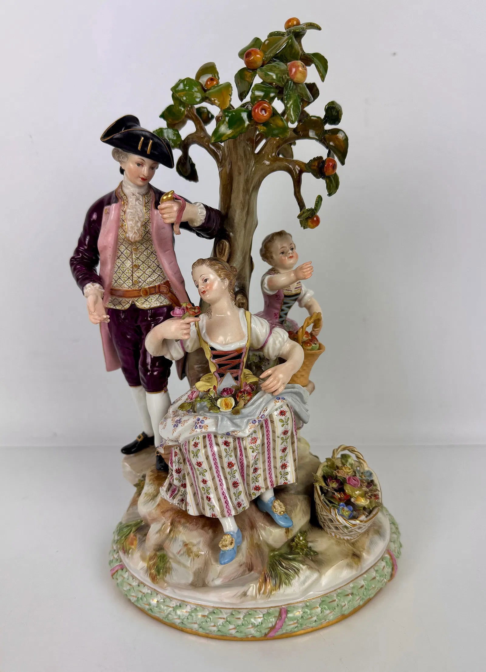 19TH C. MEISSEN GROUP: First quality mark. Measures 10 inches tall. In very good condition, one finger restored, and some leavers were professionally restored. Estimate $1000-1200