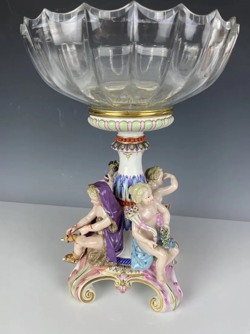 LARGE MEISSEN AND BACCARAT GLASS CENTERPIECE: Circa 1880. Depicting the 4 seasons. Measures 15 inches high, 11 inches diameter. Estimate $5.000-6.000