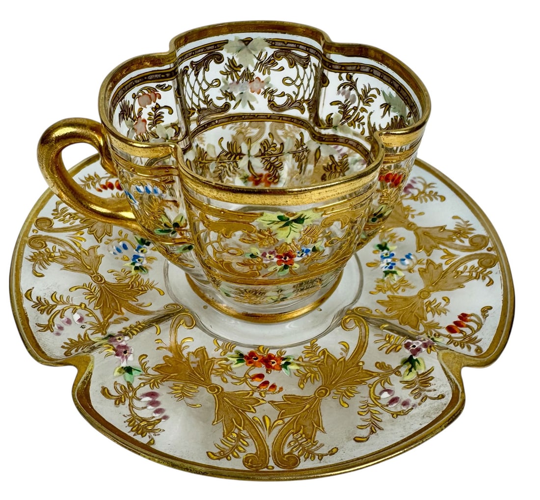 A FINE GILT AND ENAMELLED MOSER DEMITASSE CUP AND SAUCER: Circa 1900. In excellent condition. Estimate $400-500