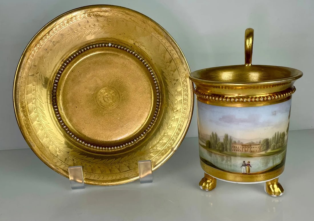 A LARGE 19TH C. CONTINENTAL PORCELAIN TOPOGRAPHICAL CUP AND SAUCER: Saucer measures 6 inches d. Estimate $800-1000