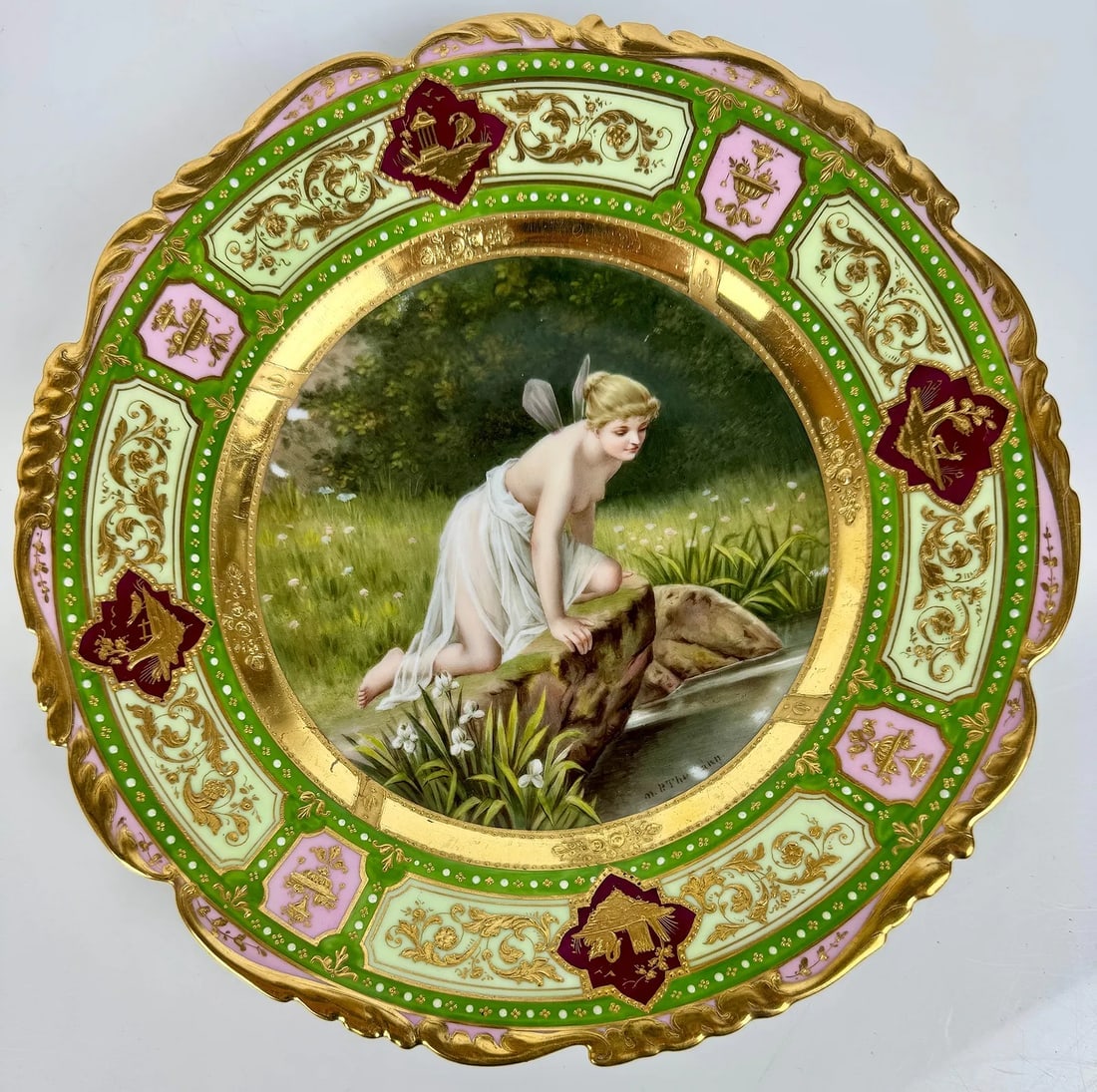 ROYAL VIENNA PLATE: CIRCA 1900. Artist signed. Measures 10 inches d. In good condition, no damage detected.Estimate $800-1000