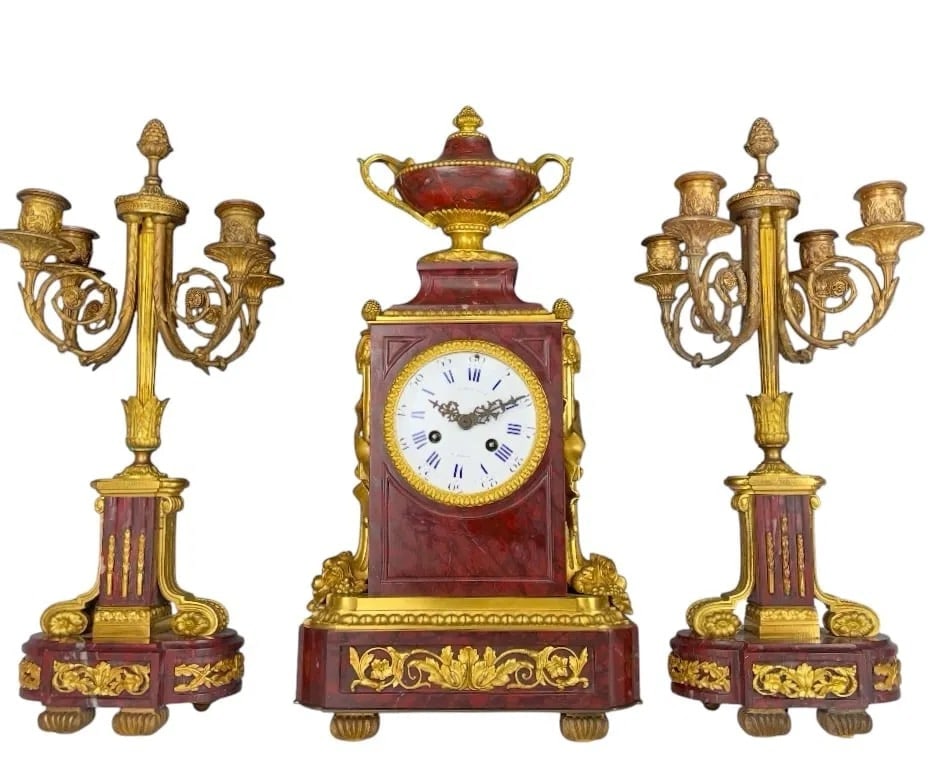 19TH C. ORMOLU AND ROUGE MARBLE CLOCK SET: the clock with white enamel dial with blue Roman hours and Arabic minute track, signed "Raingo Fres. / a Paris", the movement with "Raingo Freres Paris" pastille and stamped "3644", 19 1/2 x 9 1/2 x 5