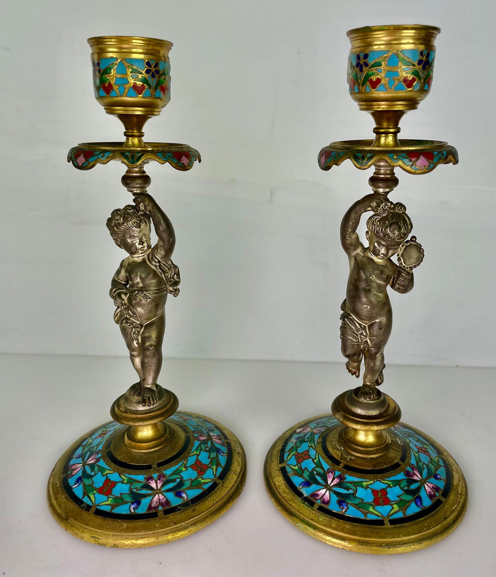 A PAIR OF 19TH C. FRENCH CHAMPLEVE ENAMEL CANDEL HOLDERS: Measure 7.5” h. Estimate $600-800