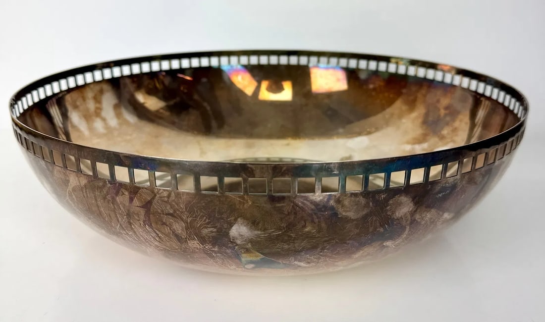 A LARGE SWID POWELL SILVER PLATED BOWL: Circa 1980. Measures 14 inches d. In good used condition, some age related scratches on the bottom Estimate $600-800