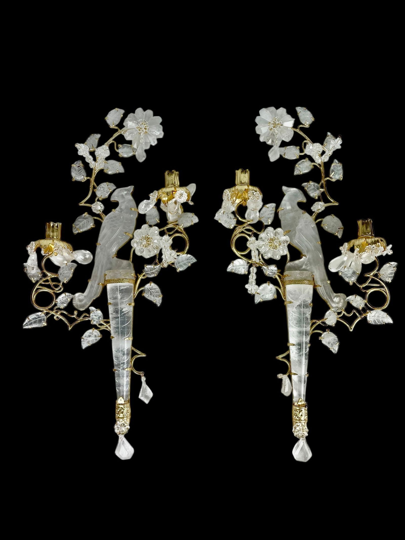 A MAGNIFICENT PAIR OF MAISON BAGUES STYLE ROCK CRYSTAL APPLIQUES: A large pair of Maison Baguès-style rock crystal and gilt-metal parrot wall sconces. Measure 28 inches tall. Estimate $5000-6000