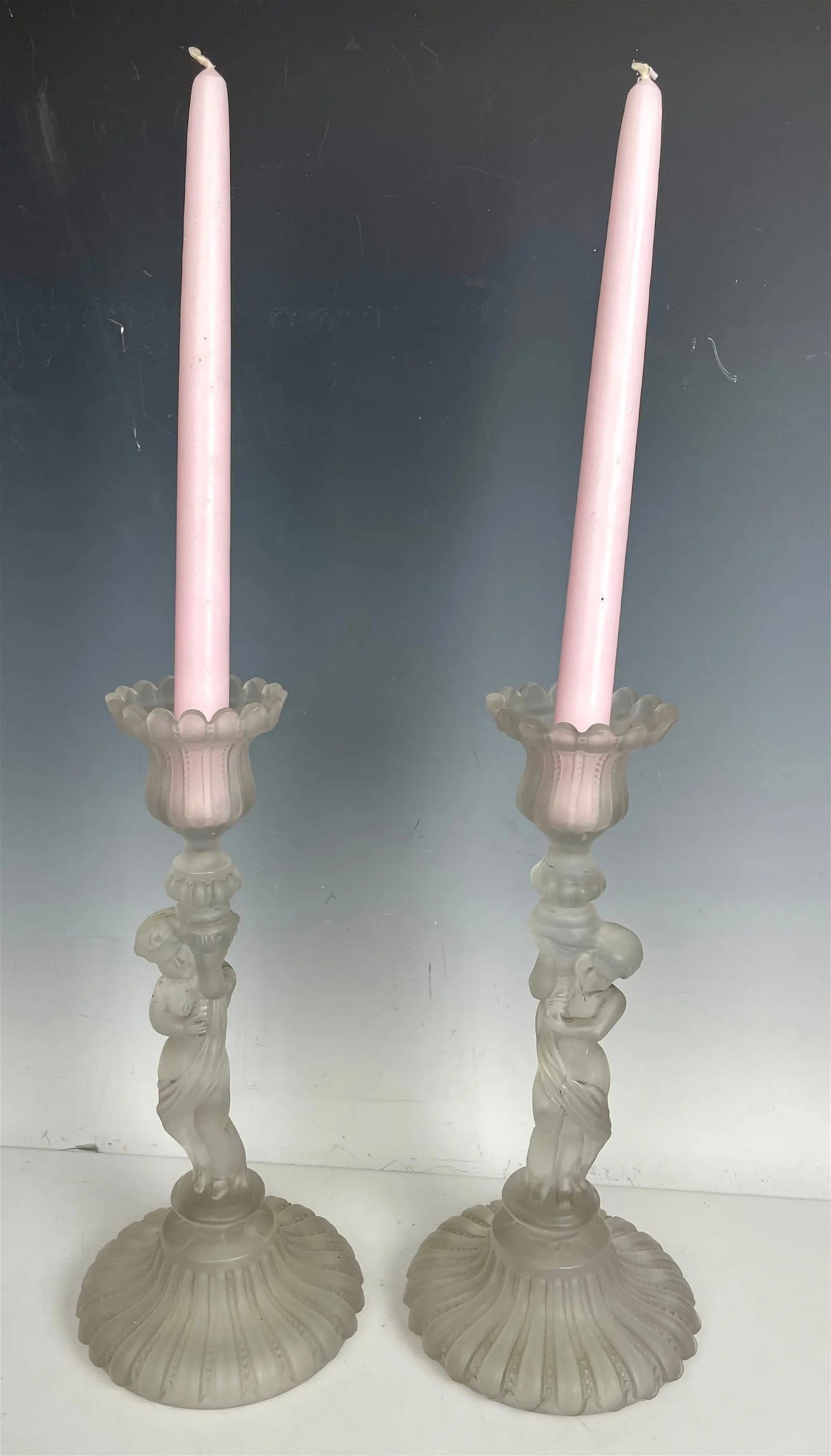 A PAIR OF BACCARAT CANDEL HOLDERS: Measure 9 inches tall. In good used condition. Estimate $600-800