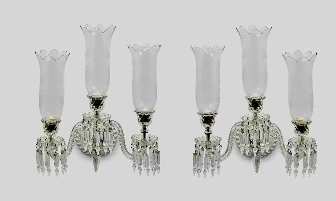 A SIGNED PAIR OF 3 LIGHT BACCARAT WALL SCONSES: Circa 1950. Signed Baccarat. Dimensions : 22.5" H x 18" W x 12.5" D. In good condition. Estimate $2500-3000