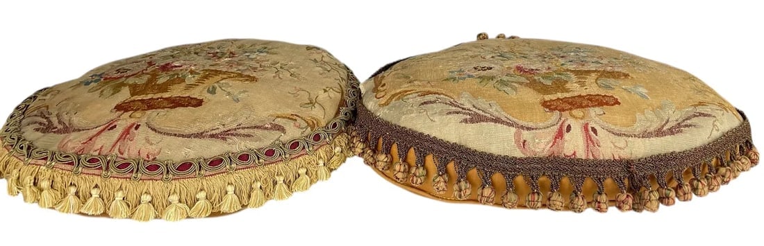 A PAIR OF TAPESTRY TOP PILLOWS CIRCA 1750: Round measures 18 inches d. Condition used as pictured. Estimate $800-1000