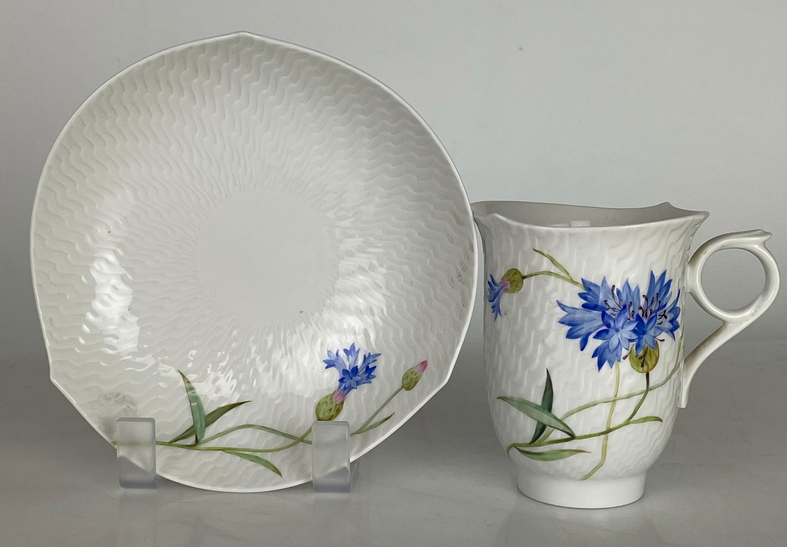 A LARGE MEISSEN CUP AND SAUCER: First quality. In mint condition. Estimate $600-800