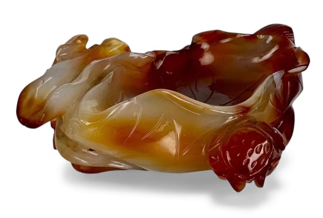 CHINESE CORNELIAN AGATE BRUSH POT: Circa 1900. Measures 4.9 inches long. Estimate $600-800