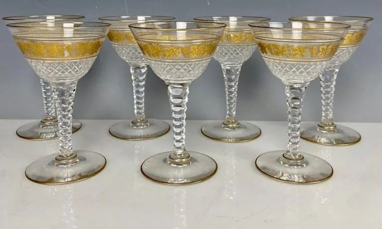 SET OF 7 GILT VAL ST LAMBERT CHAMPAGNE GLASSES: Measure 5.5 inches high. All in good condition. Estimate $800-1.000