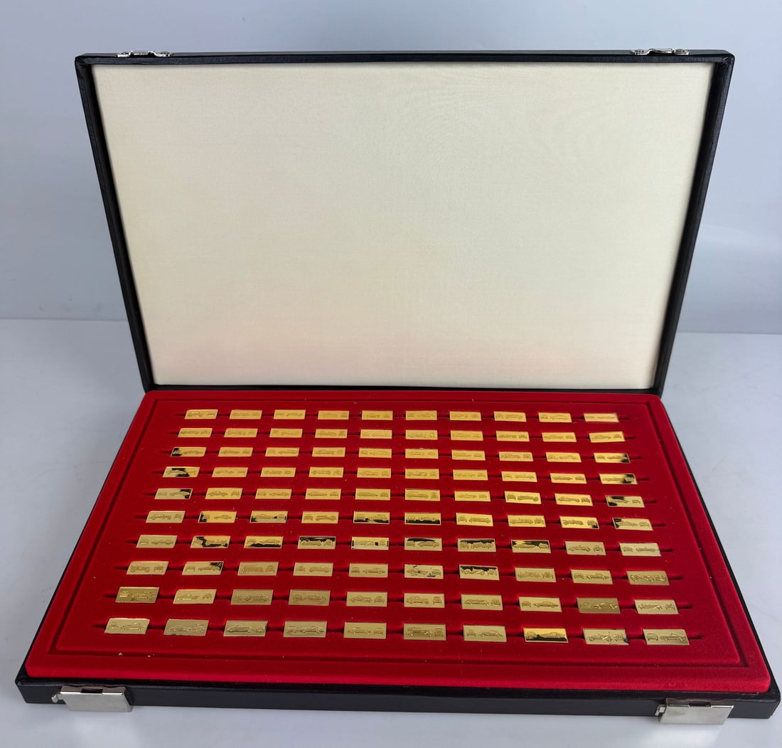 FRANKLIN MINT 24KT GOLD OVER STERLING WORLD’S PERFORMANCE CARS: 100 Sterling ingots in original presentation box. Estimate $1000-1200