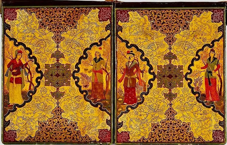 PERSIAN QAJAR PAPERMACHE BOOK COVER: in two parts, each board depicting two figures in landscapes reserved on a patterned ground Each board: 12 1/2 x 9 3/4 in. (31.8 x 24.8 cm.) Estimate $1000-1200