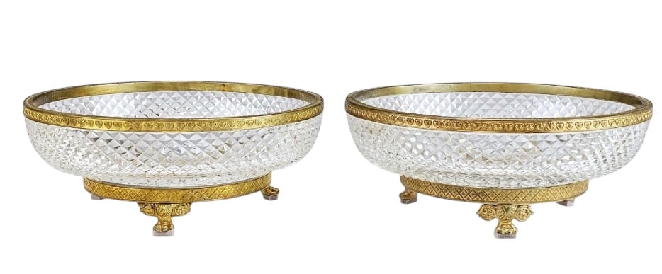 A PAIR OF ORMOLU MOUNTED BACCARAT CRYSTAL SERVING BOWLS: Circa 1900. Measures 9” d., 3.5” h. In excellent condition. Estimate $2000-2500