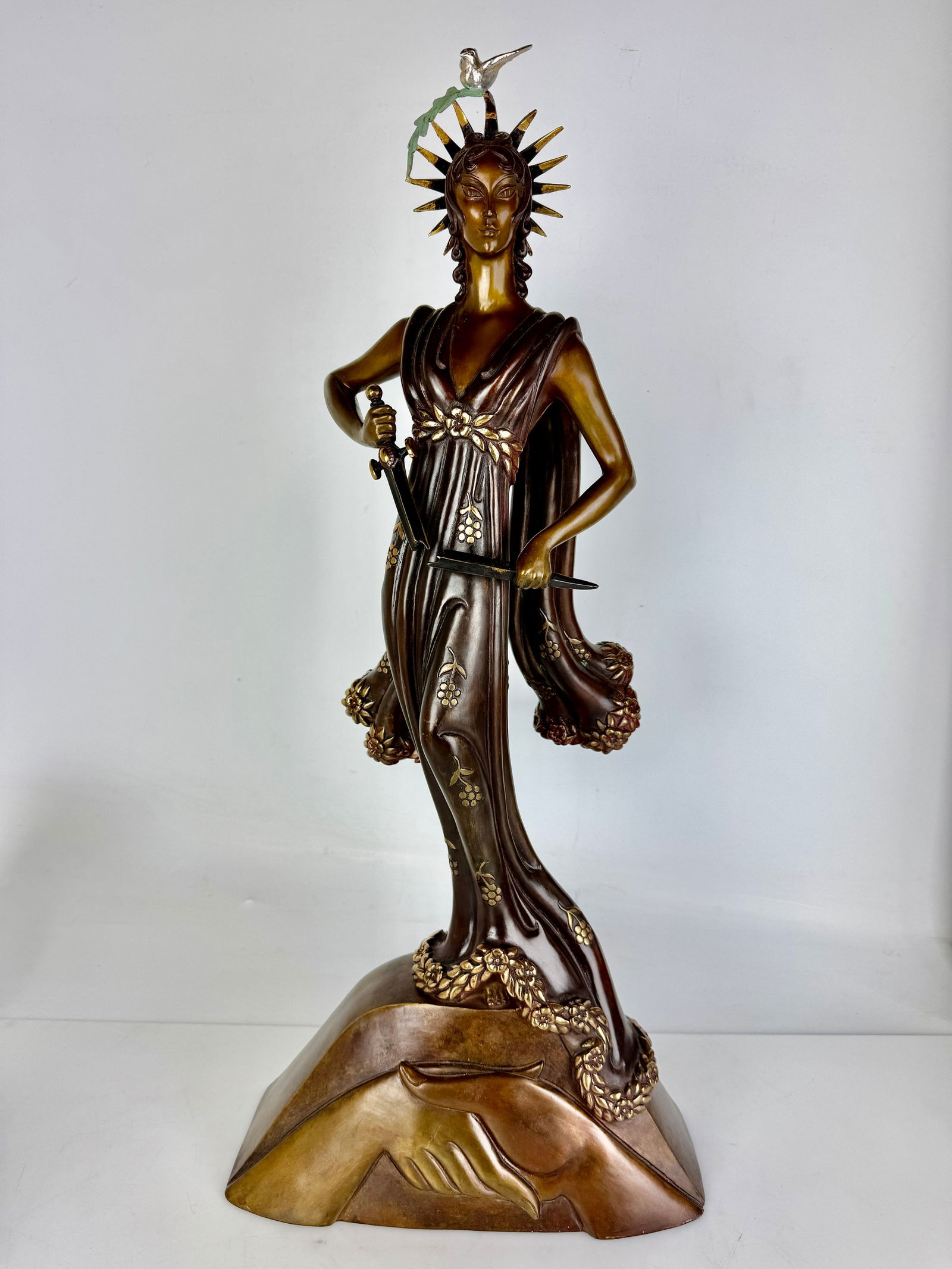 A LARGE ERTE BRONZE SCULPTURE DEPICTING PEACE: Signed ERTE, with foundry stamps. Measures 25.5” tall. In good condition. Estimate $3000-4000