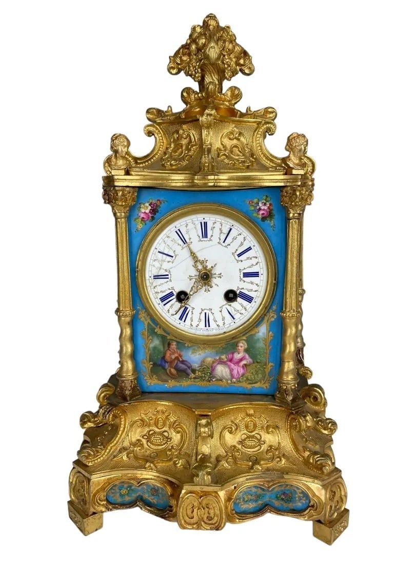 19TH C. ORMOLU AND SEVRES STYLE PORCELAIN CLOCK: Measures 10 inches high. Signed H.Piccard. Enamel face cracked. Estimate $800-1.000