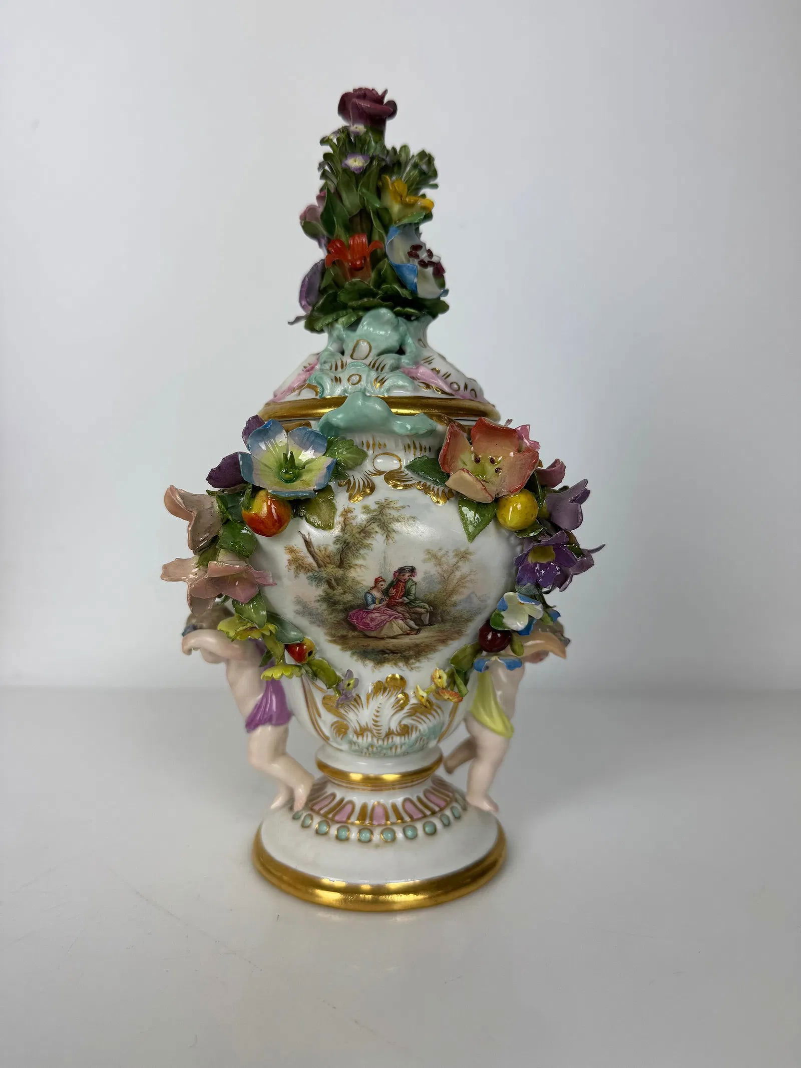 19TH C. MEISSEN MEISSEN VASE AND COVER: First quality. Painted with Watteau scene. Measures 9.5 inches h. Estimate $700-800