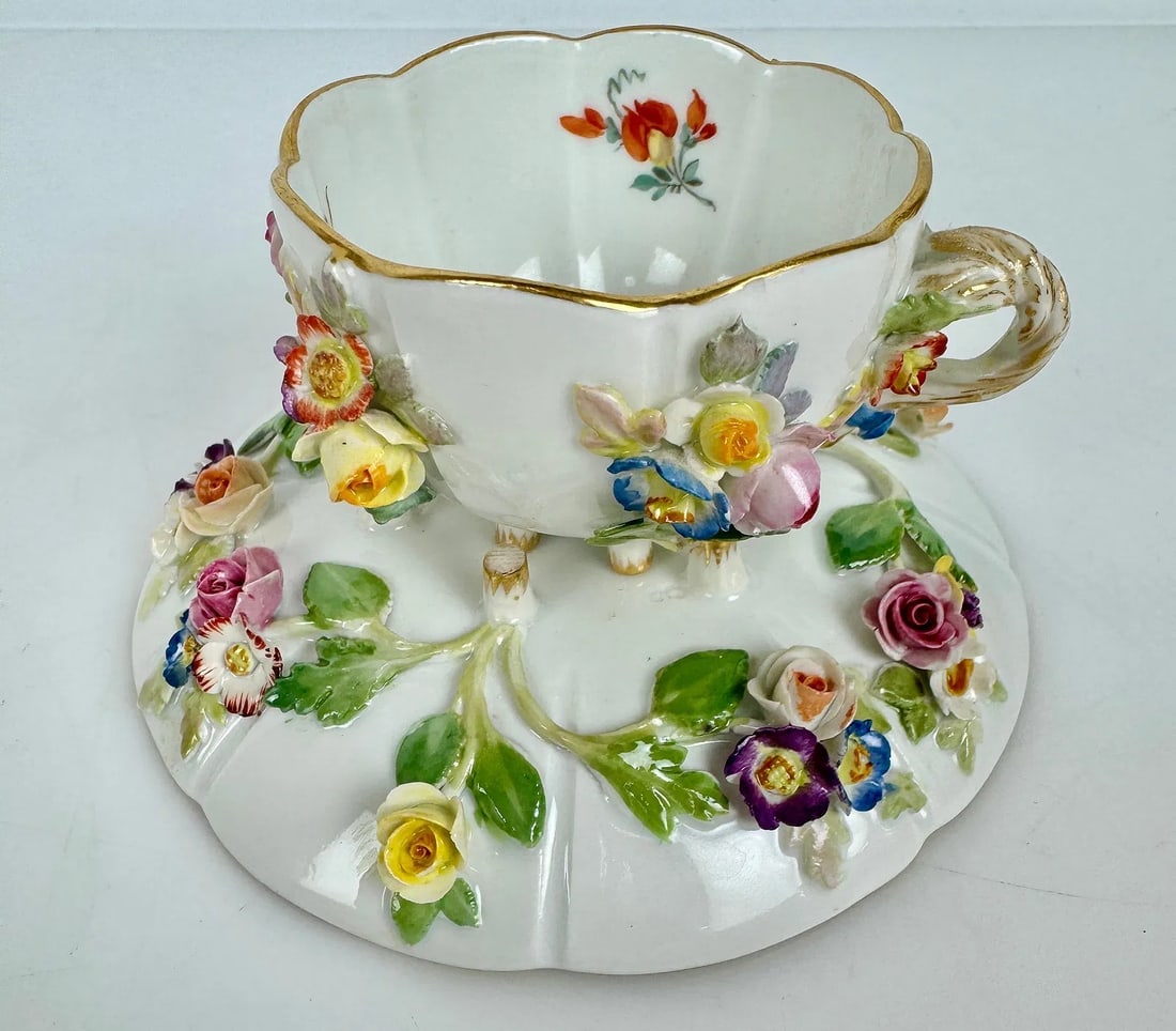 19TH C. FLOWER INCRUSTED CUP AND SAUCER: First quality, in good condition, minor loss of age related petals. Estimate $500-600
