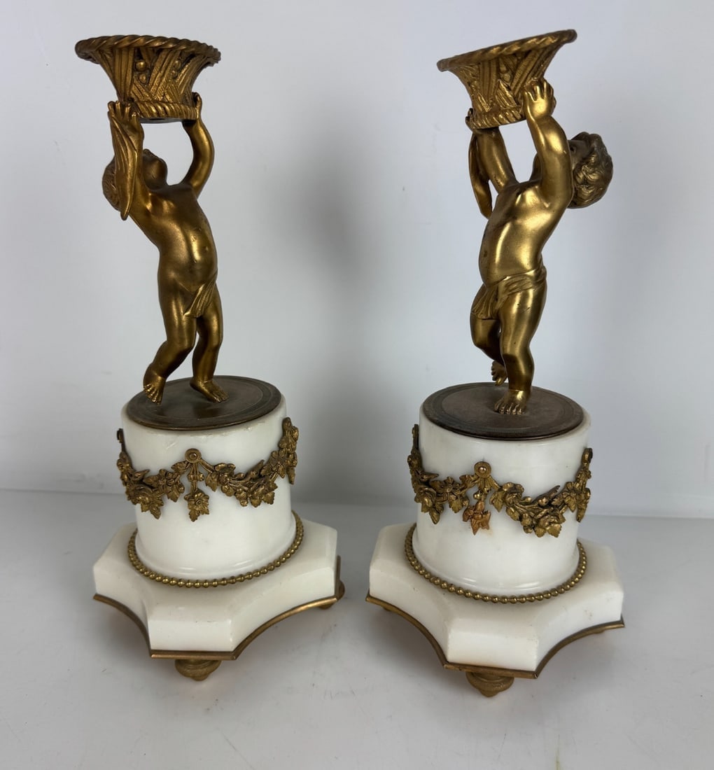 A PAIR OF ORMOLU MOUNTED MARBLE FIGURES: Circa 1900. Measures 11 inches high. In good condition. Estimate $600-800
