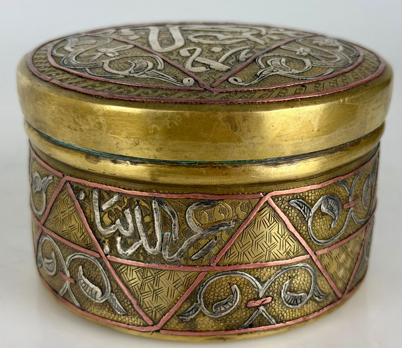 19TH C. ISLAMIC SILVER AND COPPER INLAID BOX: Measures 6.5” d. Estimate $600-800