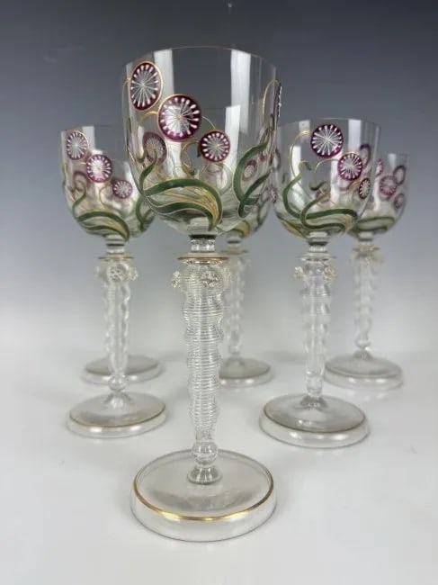 SET OF 6 GILT AND ENAMELLED MOSER WINE GLASSES: Circa 1900. Decorated in the manner of Tiffany. Measure 7.8 inches tall. All in good condition. Estimate $1.500-2.000