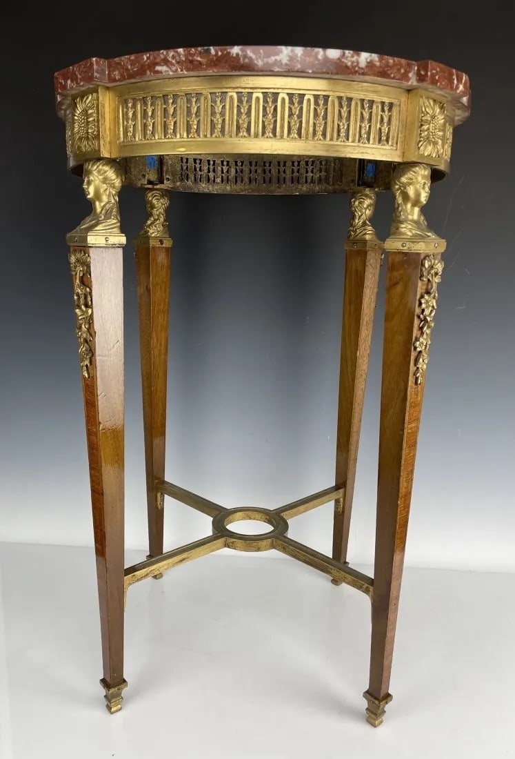 A FINE DORE BRONZE AND KINGWOOD MARBLE TOP OCCASIONAL TABLE: Circa 1900. Measures 30 inches tall, marble top 20 inches diameter ,. Estimate $4.000-5.000