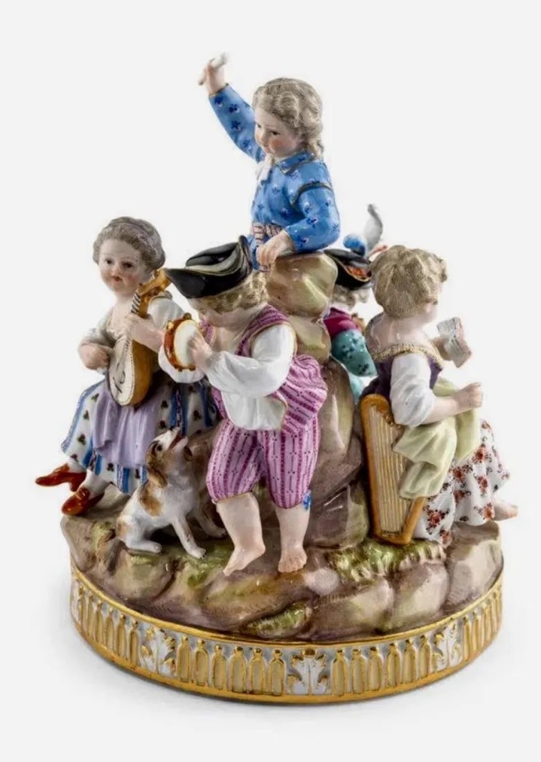 19TH C. MEISSEN MUSICAL GROUP: Circa 1880 , depicting a group of young musicians, bearing crossed swords in underglaze blue and incised B24 to the underside.Height 7 1/8 inches. In overall good condition.Estimate $1.200-1.500