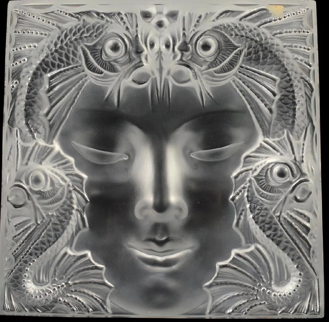 LALIQUE MASQUE DE FEMME CRYSTAL PLAQUE: Lalique France crystal plaque. 'Masque de Femme'. Large frosted crystal mask sculpture. Comes with original stainless steel stand. In very good condition with no visible chips. Measures 12.5" x 12.5"