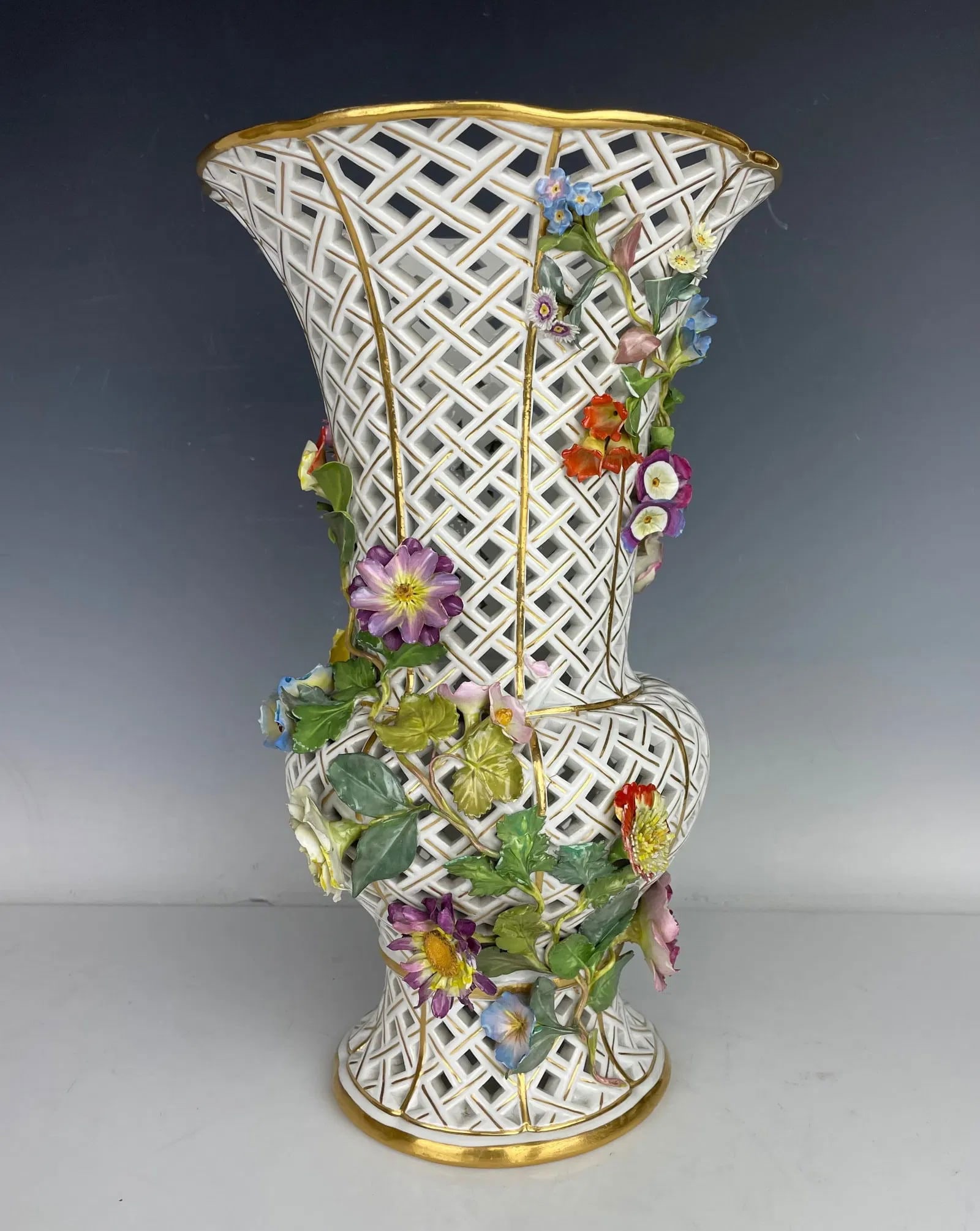 19TH C. RETICULATED FLOWER ENCRUSTED MEISSEN VASE: Circa 1900. Measures 13.5 inches h. In overall good condition, no damage to reticulation, loss of flower petals. Estimate $4000-5000