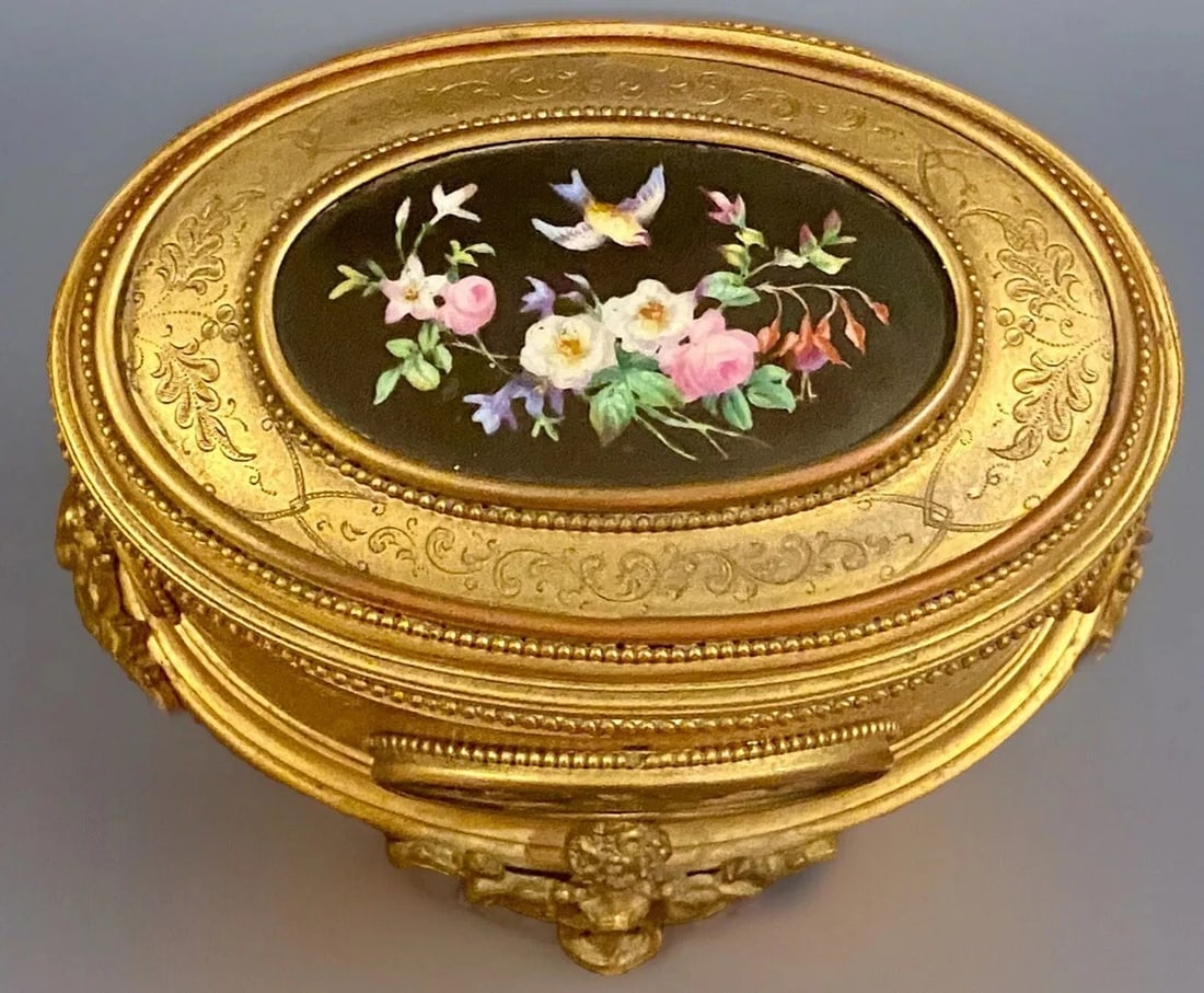 19TH C. ORMOLU MOUNTED PORCELAIN JEWELRY BOX: Dimensions: 7 inches L x 5 inches W x 5 inches H. Plaques all in good condition. Estimate $1000-1200