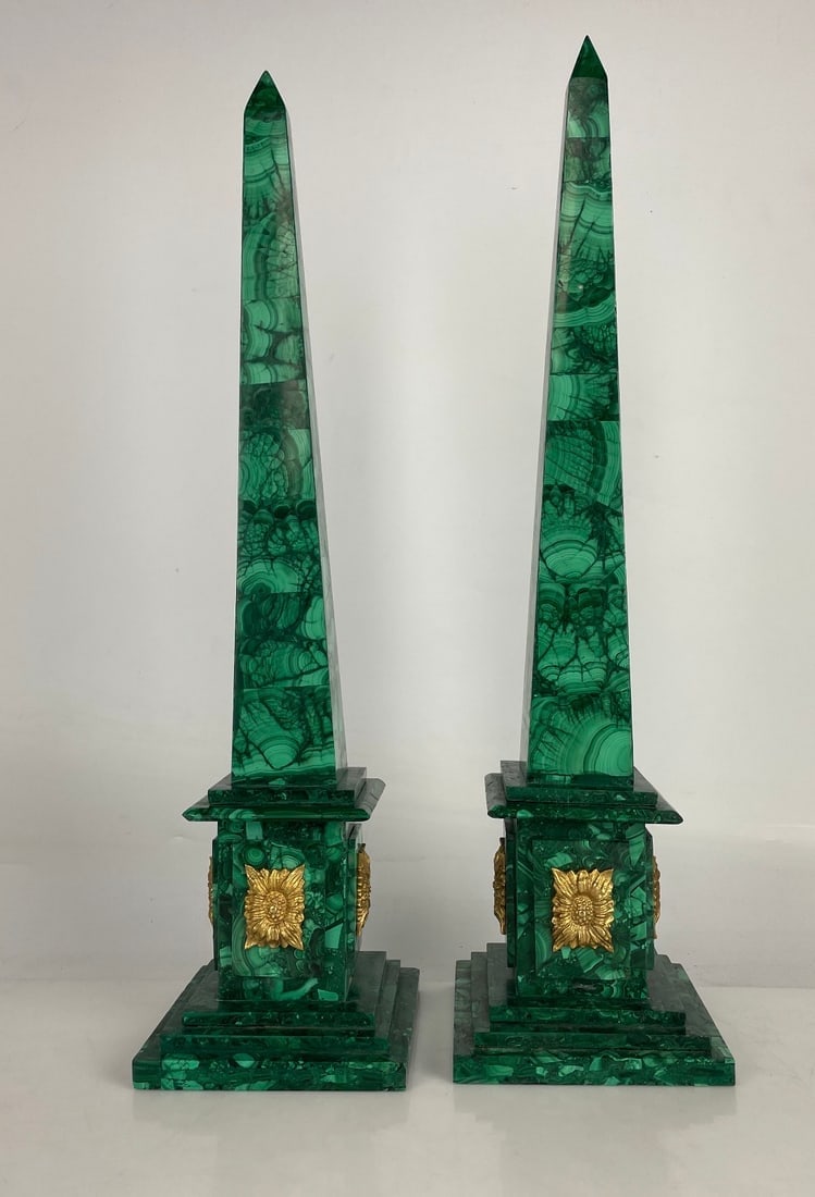 A LARGE PAIR OF ORMOLU MOUNTED MALACHITE OBLISQUES: Measure 20 inches high. In good condition. Estimate $2000-2500