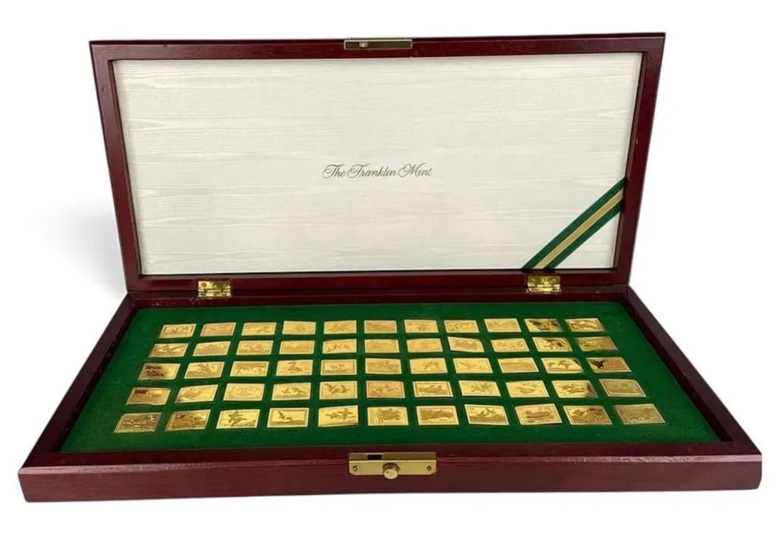 FRANKLIN MINT OFFICIAL 24KT GOLD OVER STERLING DUCK STAMPS: 50 stamps in original box . Estimate $800-1.000