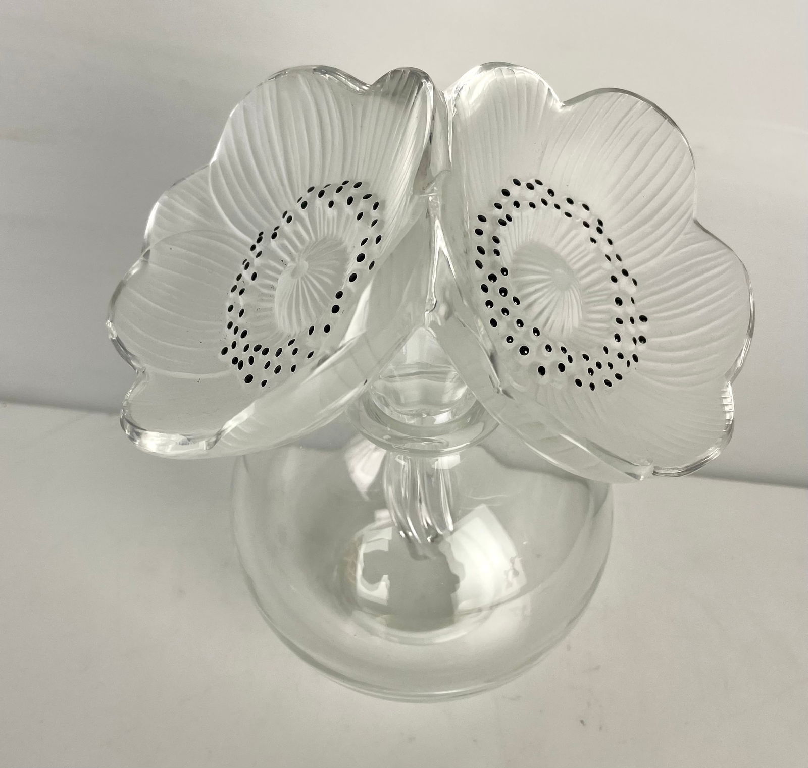 LALIQUE PERFUME BOTTLE: Lalique Perfume Bottle “Les Anemone”. Measures 6.5” h. Signed Lalique France. In excellent condition. Estimate $1500-2000