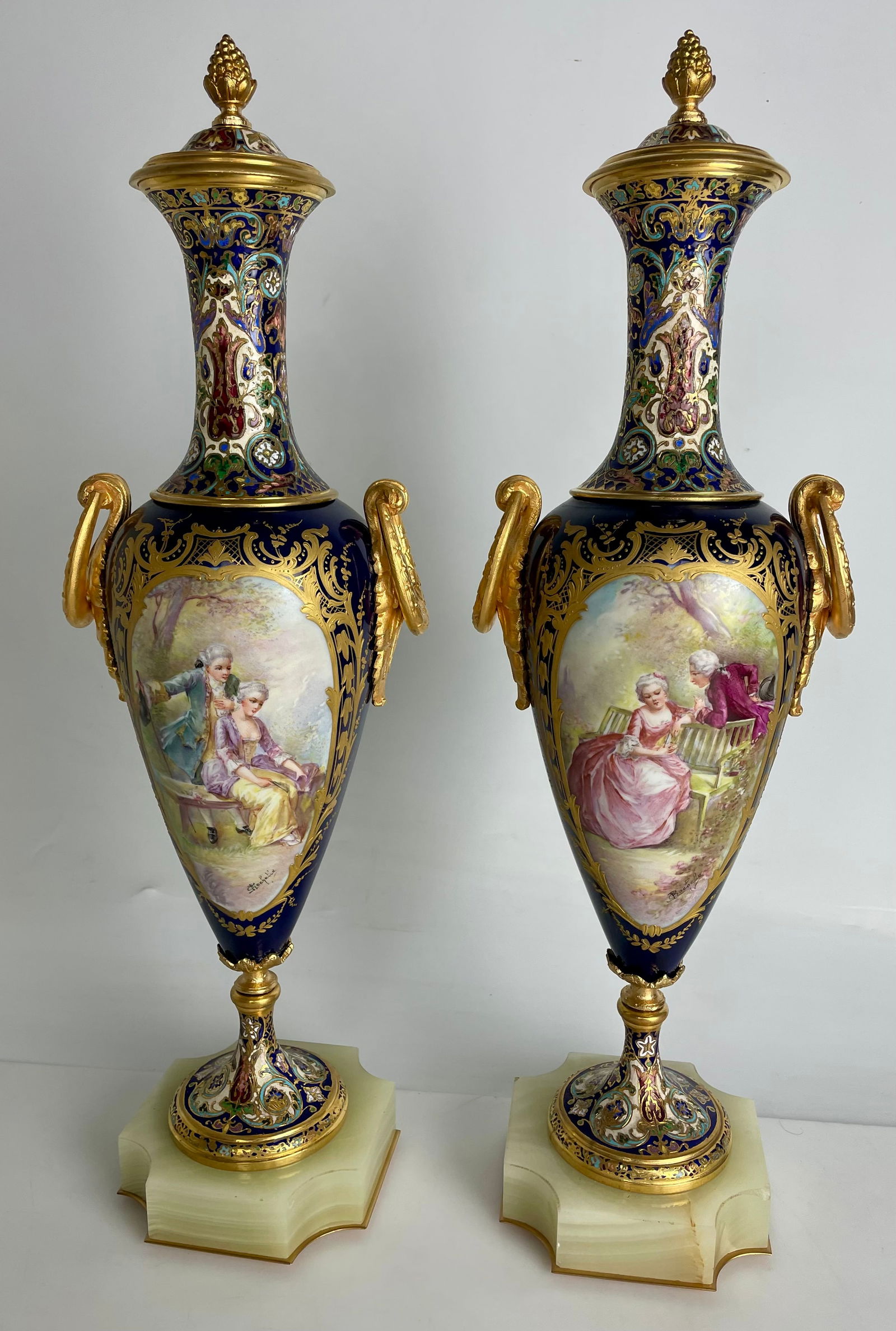 A LARGE PAIR OF CHAMPLEVE ENAMEL SEVRES PORCELAIN VASES: Circa 1900. Measures 18.5” high. Estimate $2000-2500