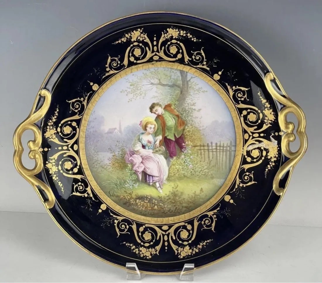 SEVRES PORCELAIN TRAY: Circa 1900. Measures 15 inches long. In good condition, minor gilt loss to handles. Estimate $1.000-1.200