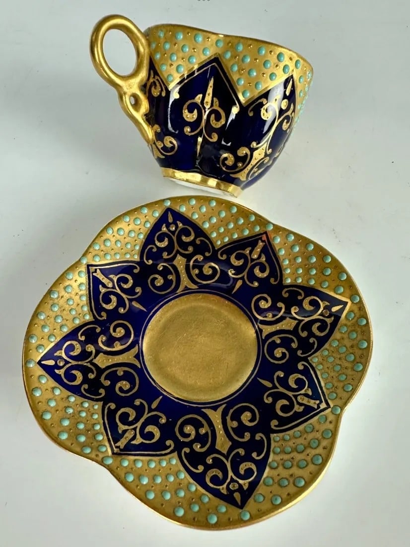 ANTIQUE JEWELED COALPORT PORCELAIN DEMITASSE CUP AND SAUCER: In good antique condition. Estimate $800-1.000