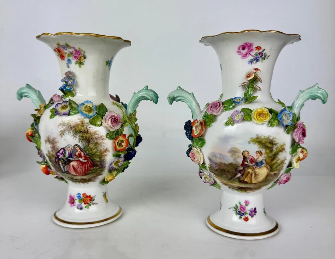 A PAIR OF 19TH C. MEISSEN FLOWER ENCRUSTED PORCELAIN VASES: Measure 6.5 inches high. Estimate $1500-2000