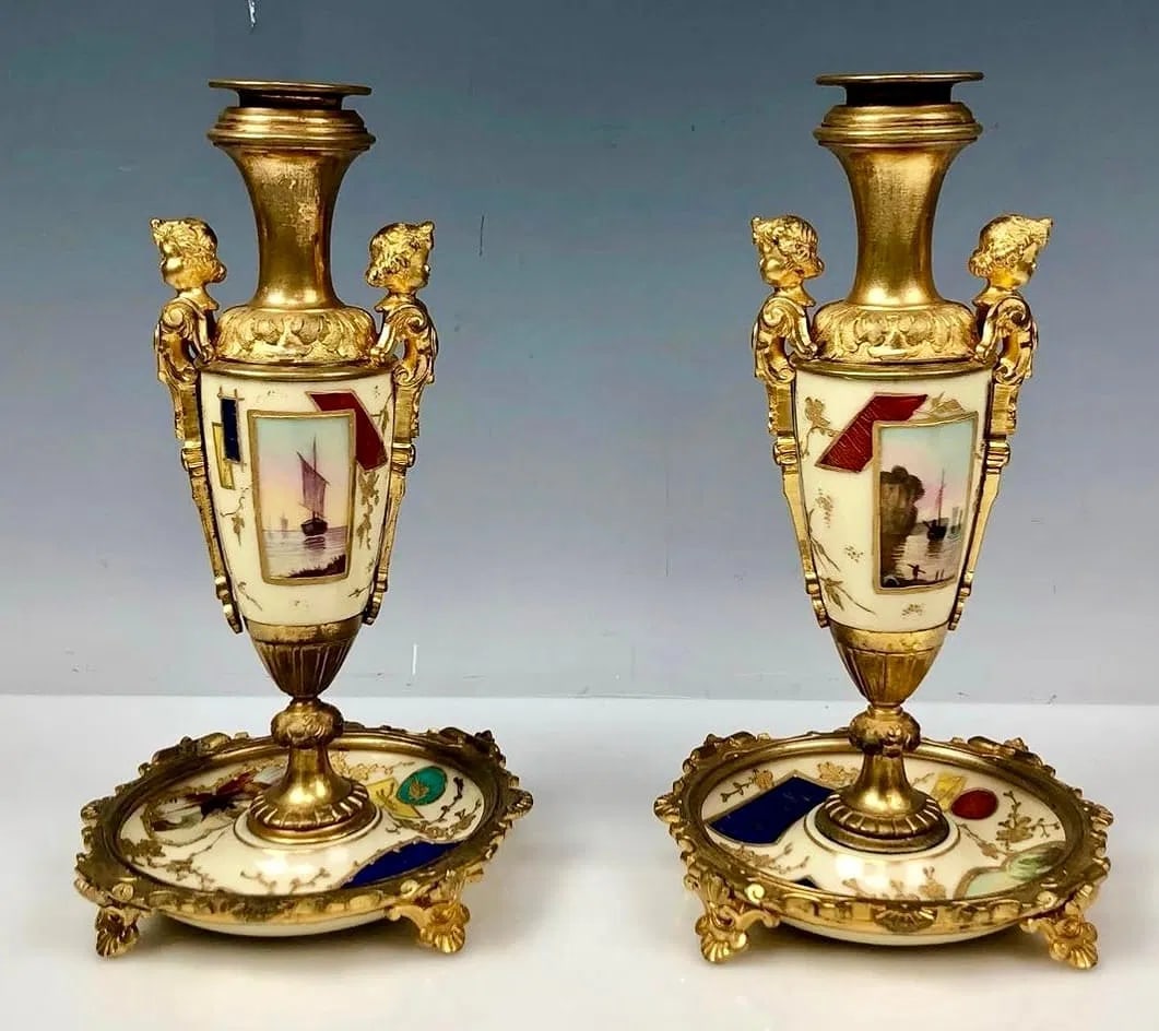 A PAIR OF ORMOLU MOUNTED PARIS PORCELAIN CANDEL HOLDERS: Circa 1900. Measure 9.5 inches high. In excellent condition. Estimate $1800-2000