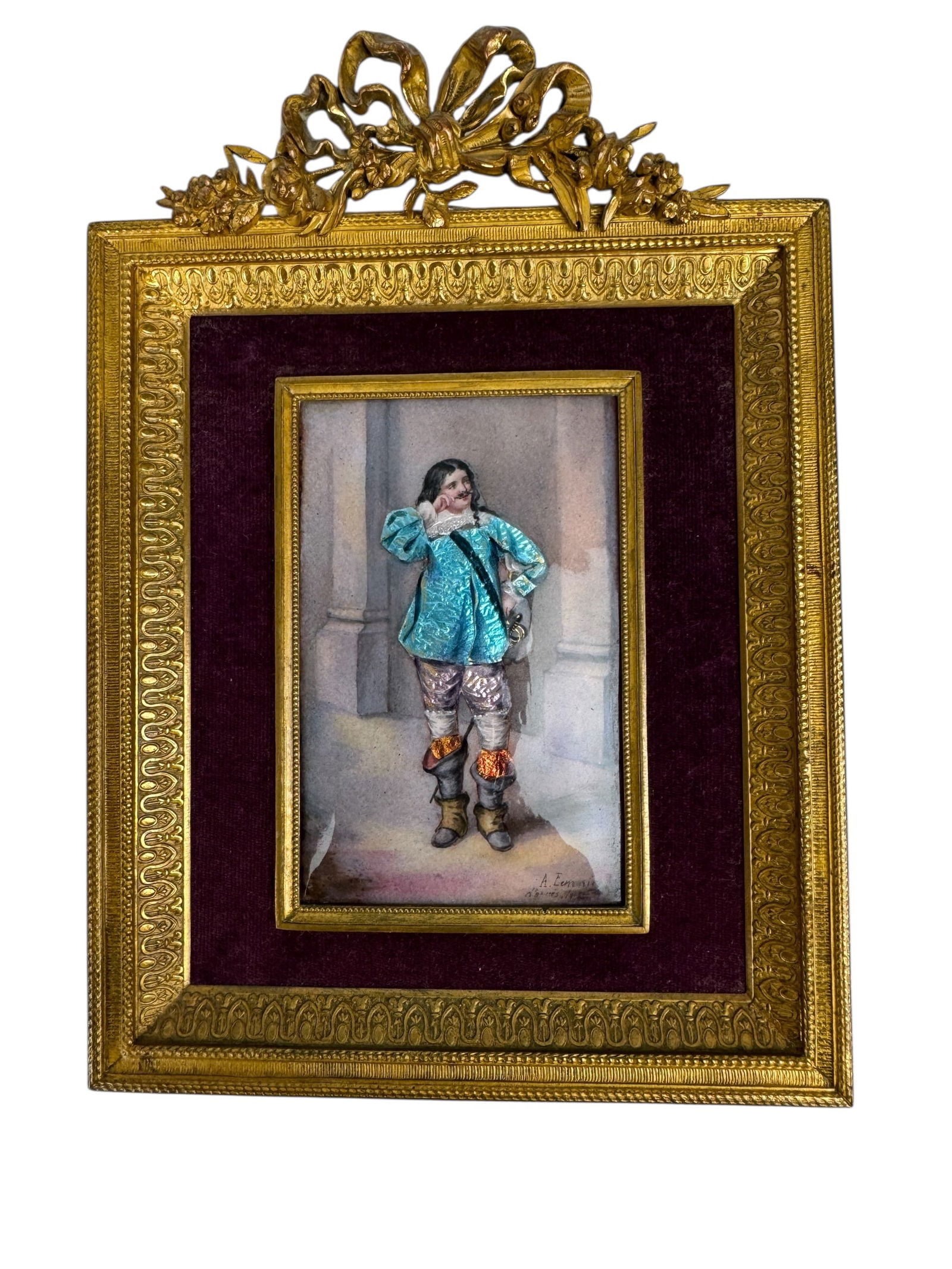 FRENCH ENAMEL HAND PAINTED PLAQUE WITH ORMOLU FRAME: Circa 1900. Measurements - Frame Ht. 7 7/8" w ribbon top, 6 3/4" w/o, W. 5 3/4" Painting Ht 4", W 2 1/4". Very good condition. Estimate $500-600