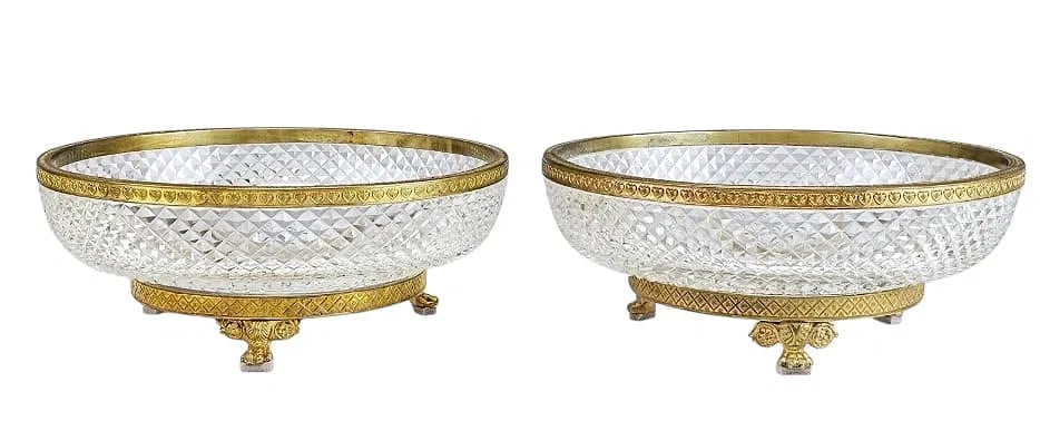 A PAIR OF ORMOLU MOUNTED BACCARAT CRYSTAL SERVING BOWLS: Circa 1900. Measures 9 inches d., 3.5 inches h. In excellent condition. Estimate $2000-2500